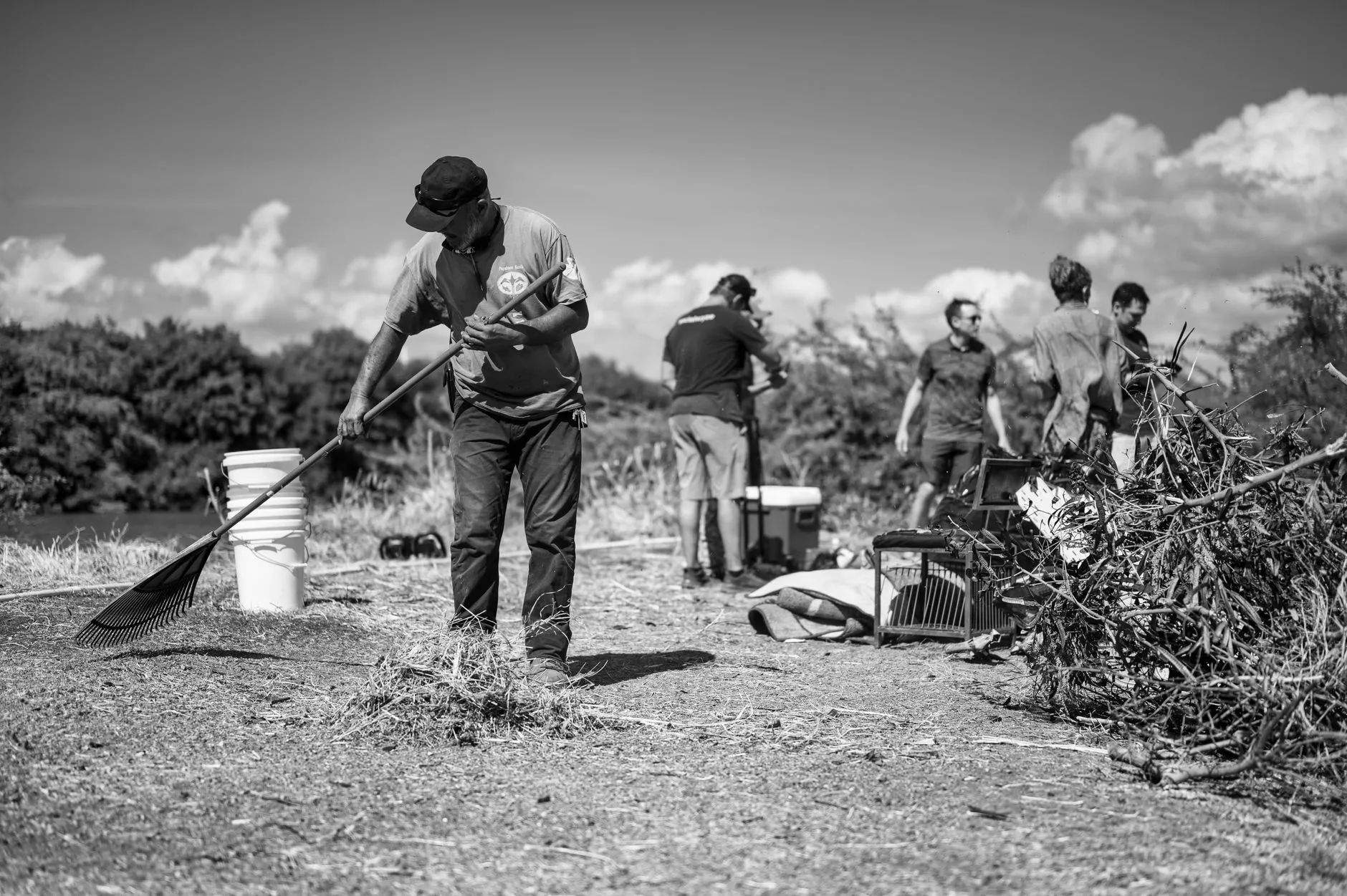 Restoration crew clearing brush